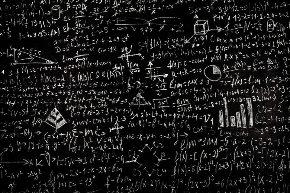 Algebraic and mathematical equations written in white chalk on a black chalkboard, showcasing complex formulas, graphs, and geometric shapes for educational or scientific contexts.